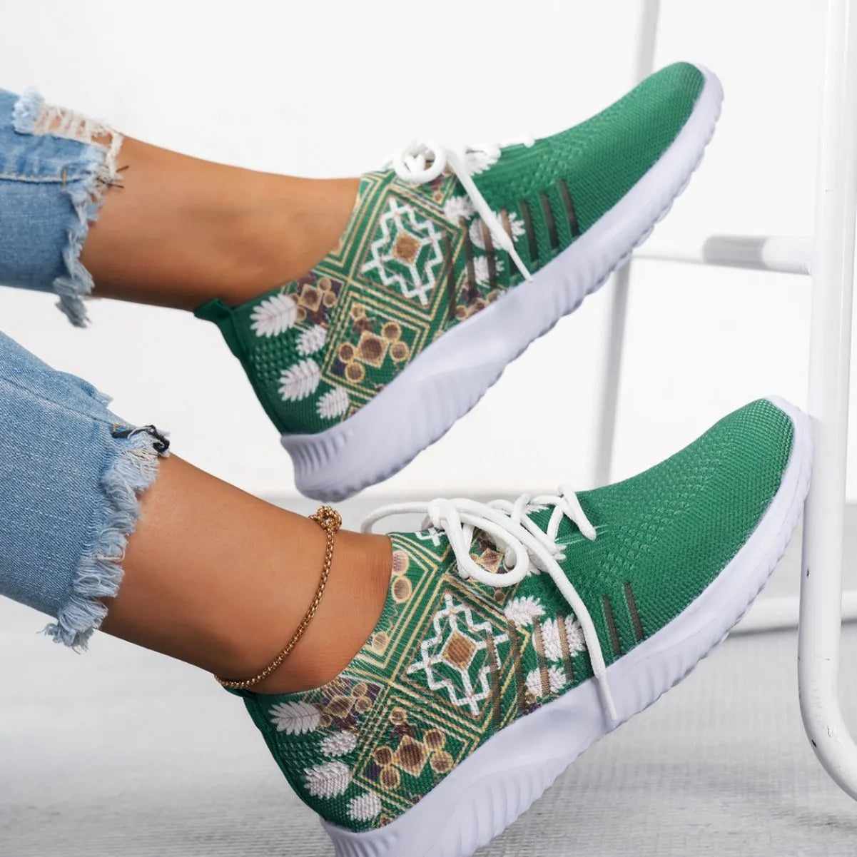 Women's woven flat casual sneakers in green with mesh upper, round toe, front lace-up, and rubber sole