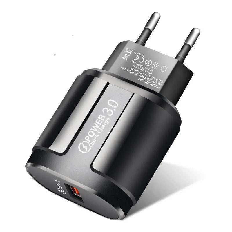 Compact international smart charger for mobile phones with EU UK US plug options in black or white