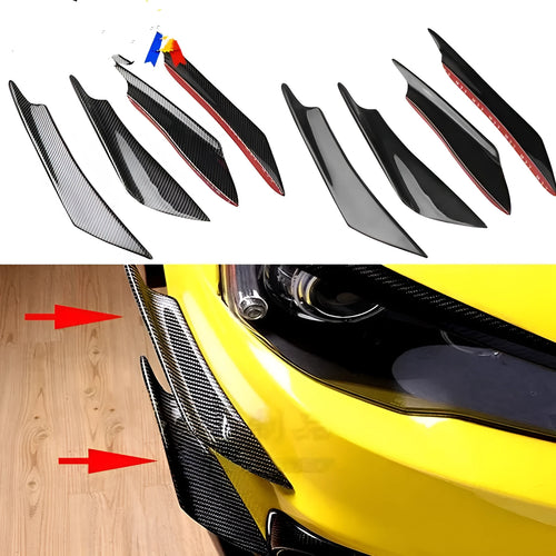Set of four carbon fibre pattern bumper blade spoilers for car modification on a black background.