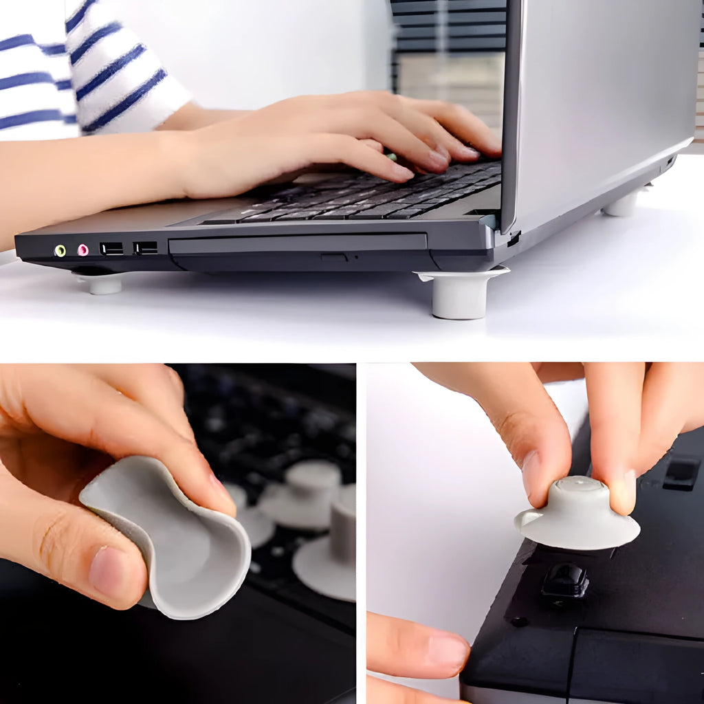 Grey laptop cooling stand with four silicone feet creating an air gap under a silver laptop.