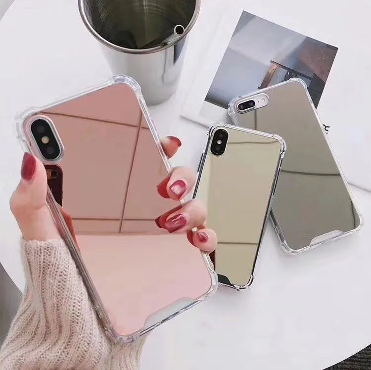 TPU mirror phone case for iPhone on a table, showing anti-fingerprint finish.