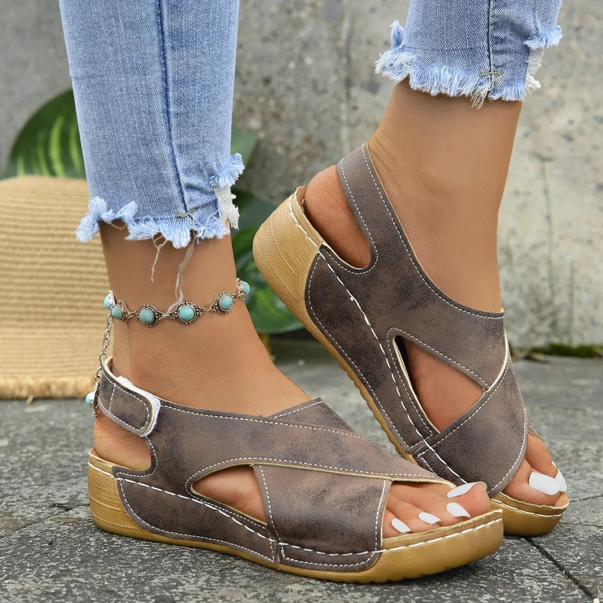 Roman platform sandals with ankle skirt and adjustable Velcro straps in a khaki colour.