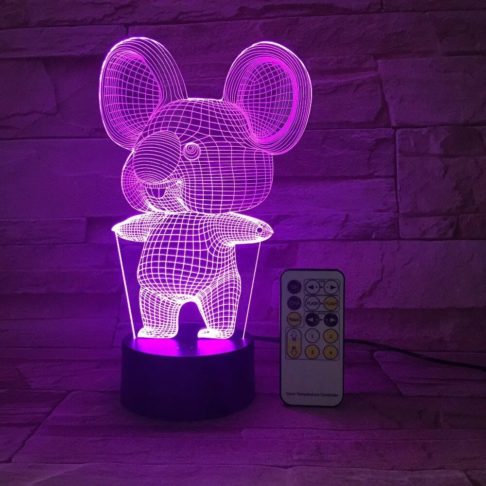 Koala-shaped night light with remote control showing seven colour options on a bedside table