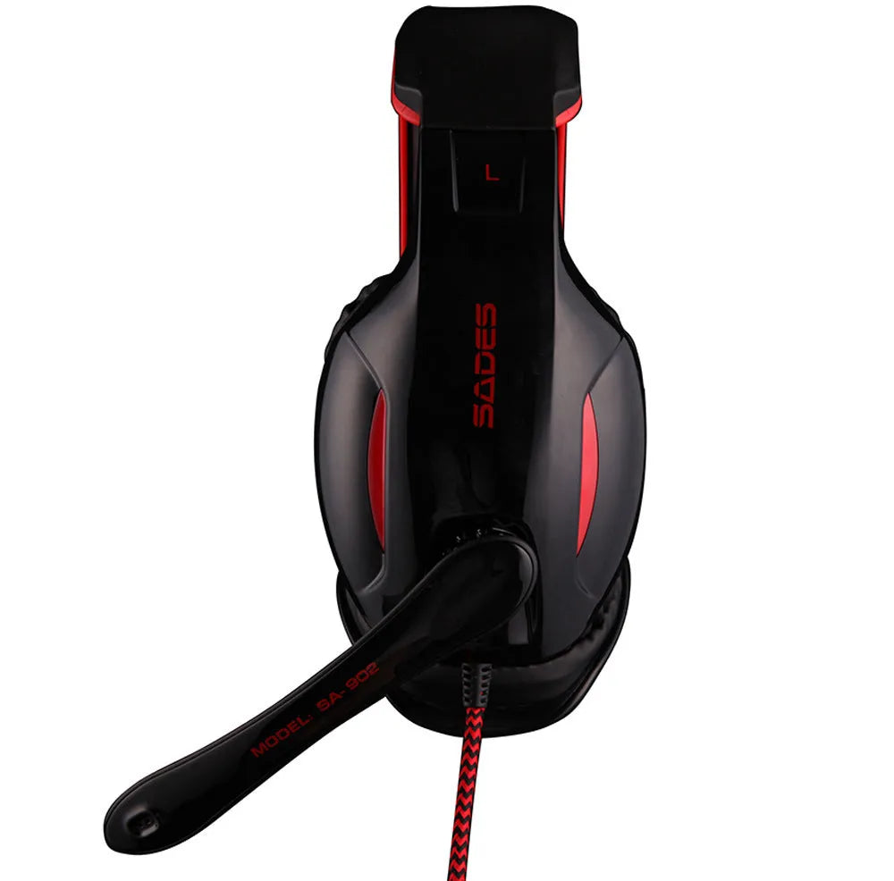 Black SADES SA 902 Hero Alliance wired USB gaming headset with over-ear cups and RGB lighting on a PC desk.