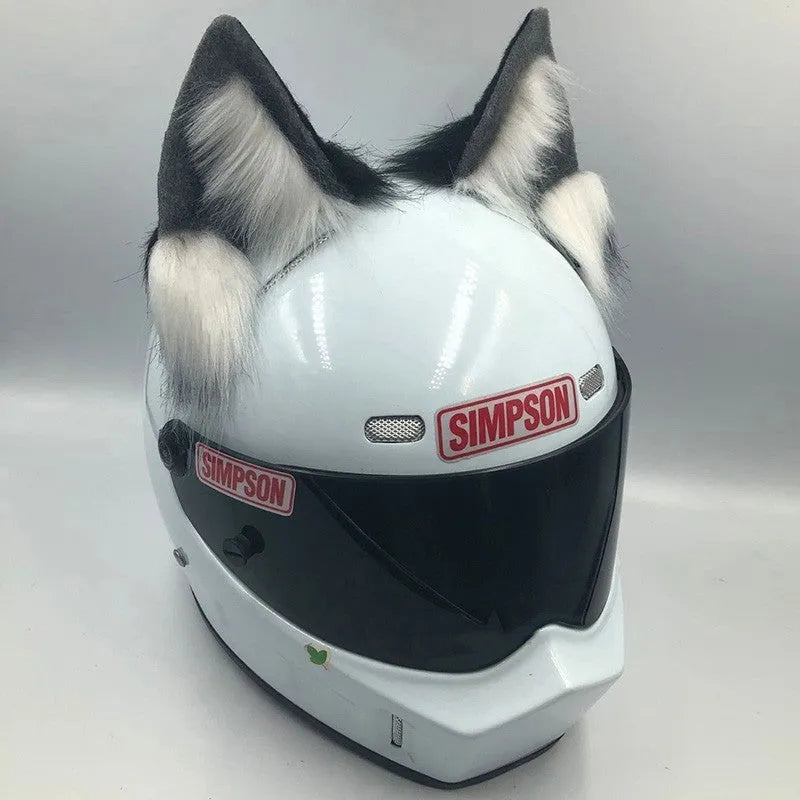 Set of black and white wolf ear and tail ornaments attached to a motorcycle helmet