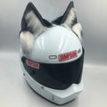 Set of black and white wolf ear and tail ornaments attached to a motorcycle helmet