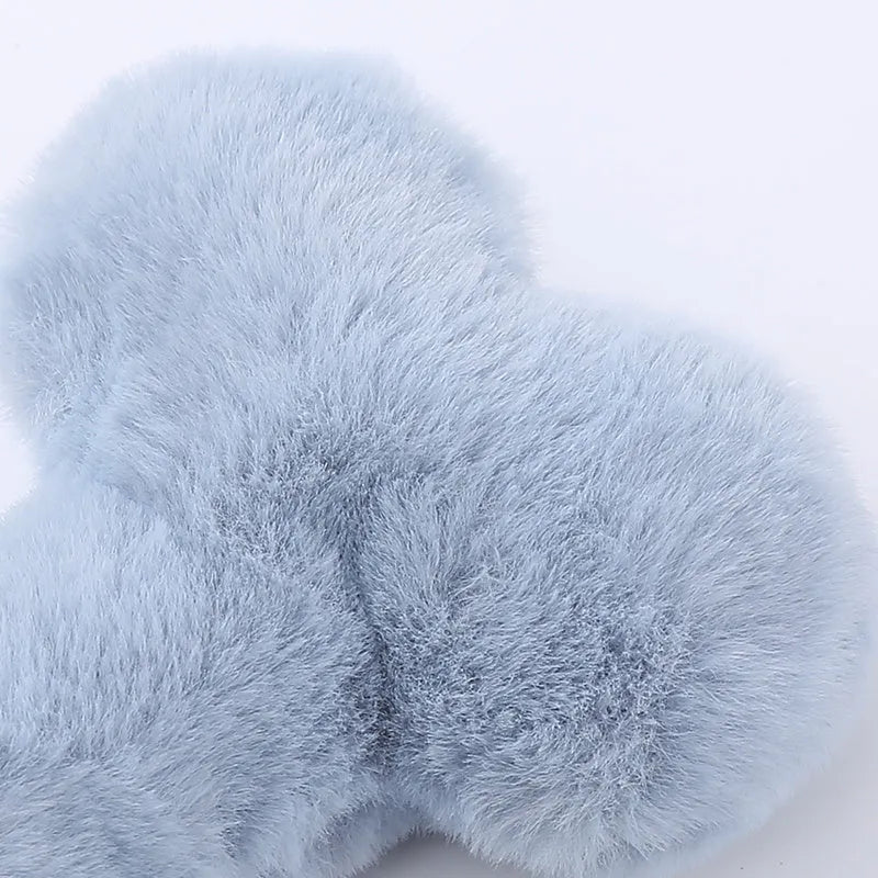 Blue love bone shaped plush dog toy with squeaker on a white background