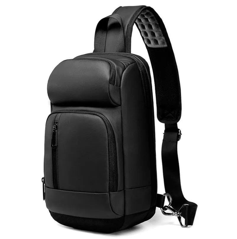 Black square vertical PVC shoulder bag showing organiser pockets and air cushion strap.