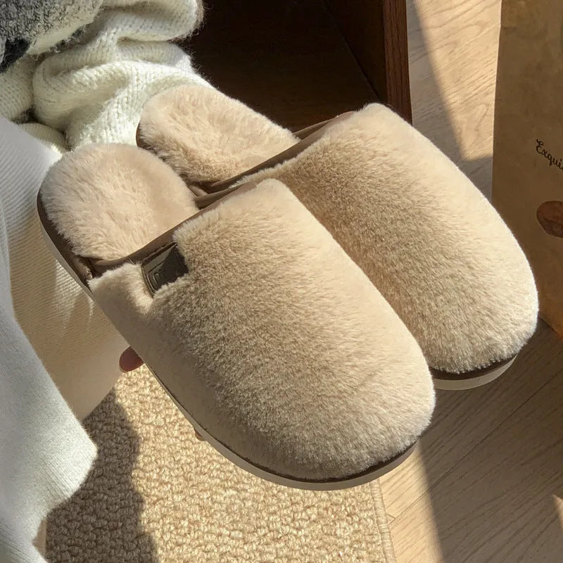 Pair of solid-colour plush PVC slippers with an overshoe design and a textured non-slip sole.
