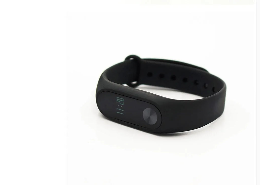 Xiaomi Mi Band 2 black smart band with OLED screen on an adjustable grey wrist strap.