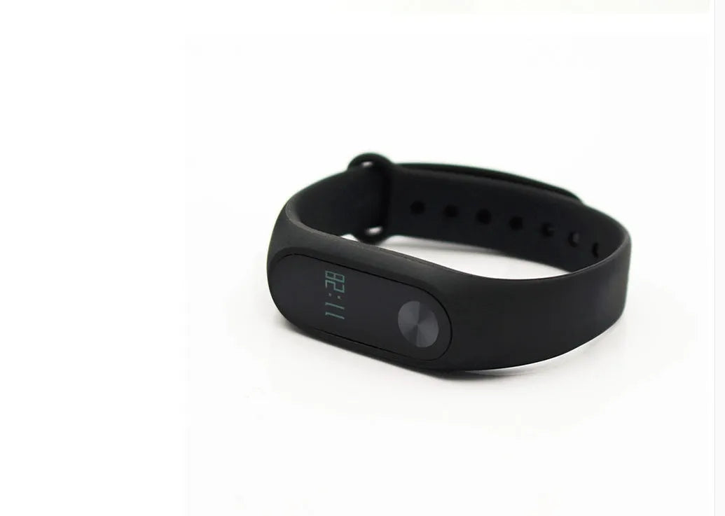 Xiaomi Mi Band 2 black smart band with OLED screen on an adjustable grey wrist strap.