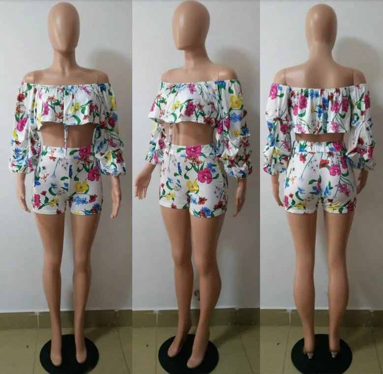 Women's multicolour digital print lounge set with puff-sleeved top and shorts.