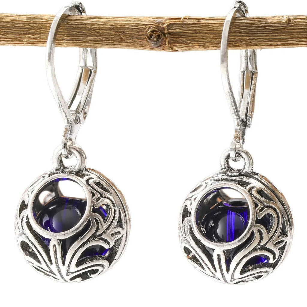 Silver-coloured vintage engraving hollow geometric pendant earrings with blue gemstone