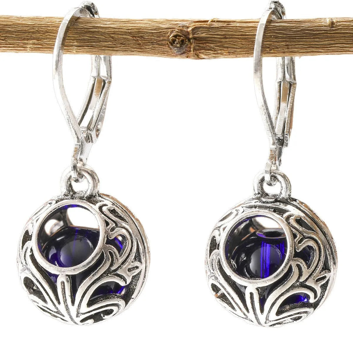 Silver-coloured vintage engraving hollow geometric pendant earrings with blue gemstone