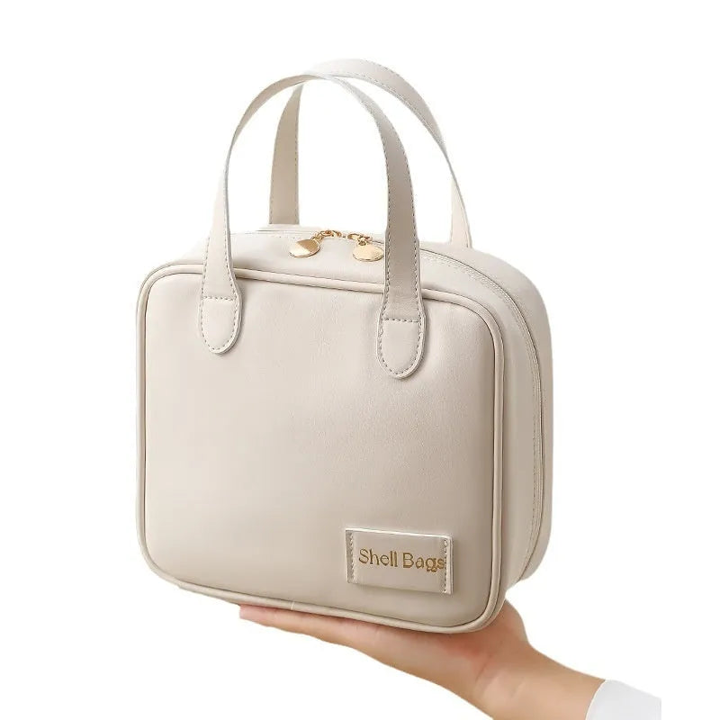 PU leather travel makeup bag in caramel mocha, 21x8x19cm, open to show compartments for cosmetics and toiletries