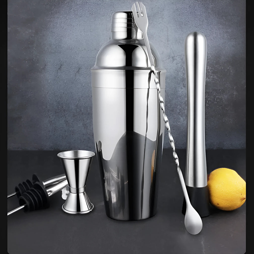 23-piece stainless steel cocktail set with acrylic shakers and bar tools laid out.