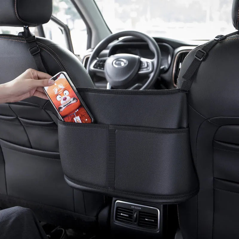Black leather car seat storage bag with carbon fibre pattern, dimensions 38x24x15cm