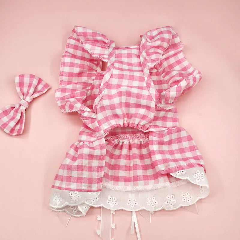 Breathable lace and plaid gauze dog skirt in Pink Daisy with matching bow necklace on a small dog