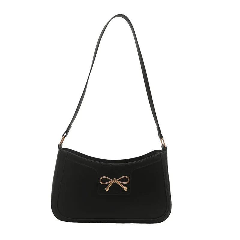 Western style PU leather shoulder bag in horizontal square shape with bow decoration, shown in rose pink colour.