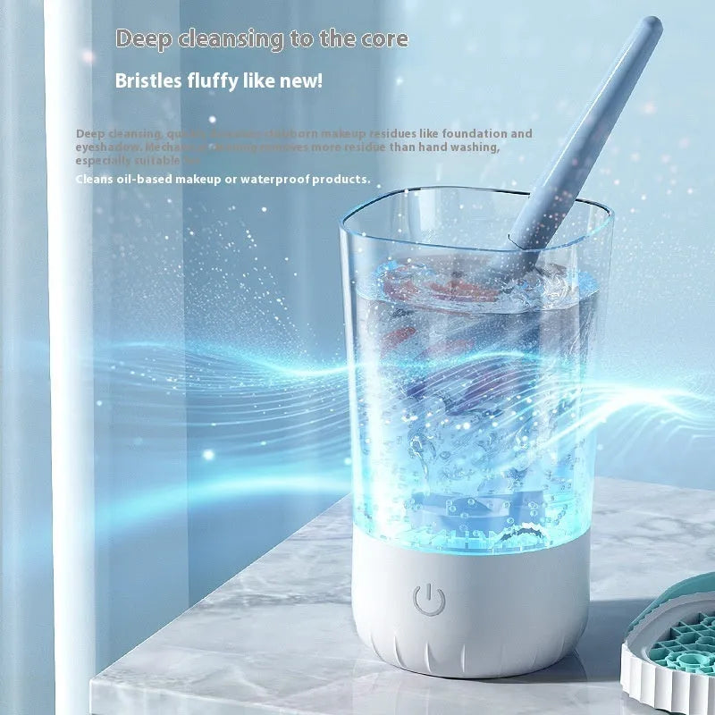 White plastic rechargeable electric cleaning brush for makeup brushes.