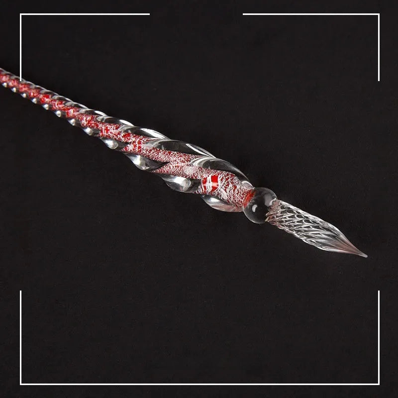 Transparent glass crystal pen with coloured ink dipped in water art effect showing coloured glaze decorative technique