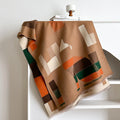 Long beige cashmere-like polyester scarf in a European chic style, laid flat to show its 185cm length.