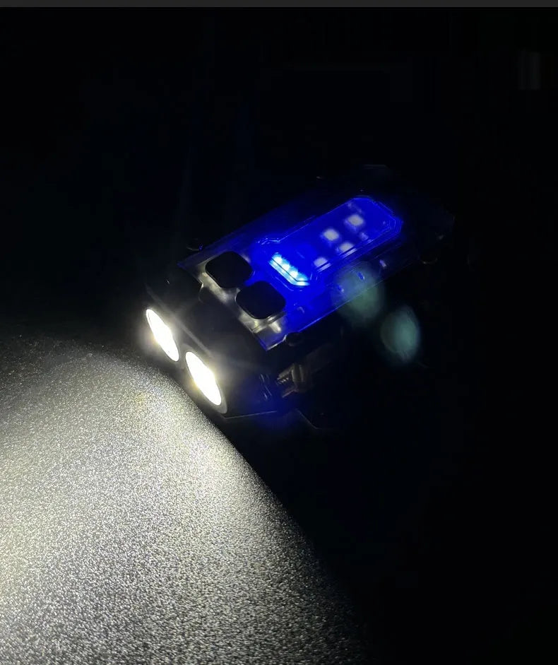 Portable tactical torch with USB cable mounted on a backpack strap.