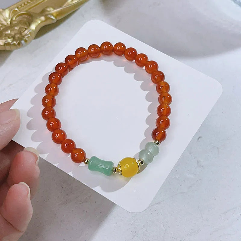 Handcrafted red agate bracelet for women with Chinese dragon design and lucky charm variations