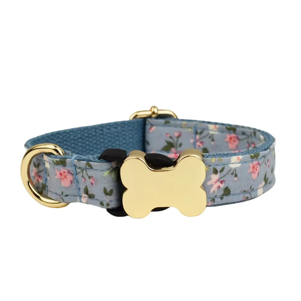 Flat nylon dog collar with a printed grid design and a bone-shaped metal buckle in assorted colours.