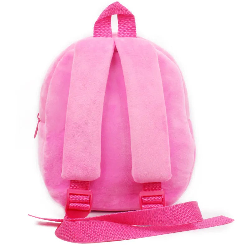 Small pink cartoon backpack for a baby or toddler aged 1 to 2 years, compact everyday bag.