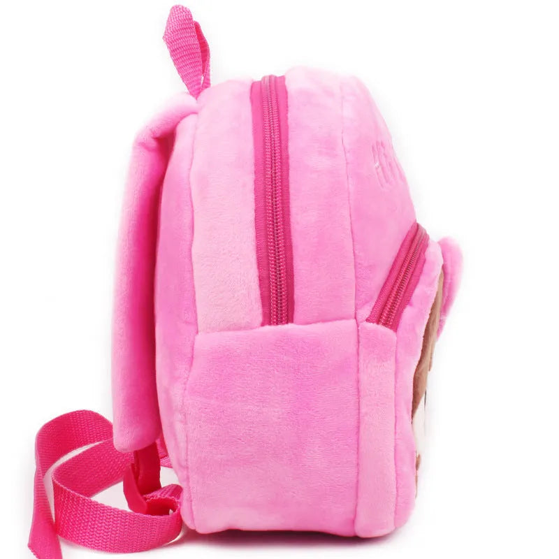 Small pink cartoon backpack for a baby or toddler aged 1 to 2 years, compact everyday bag.