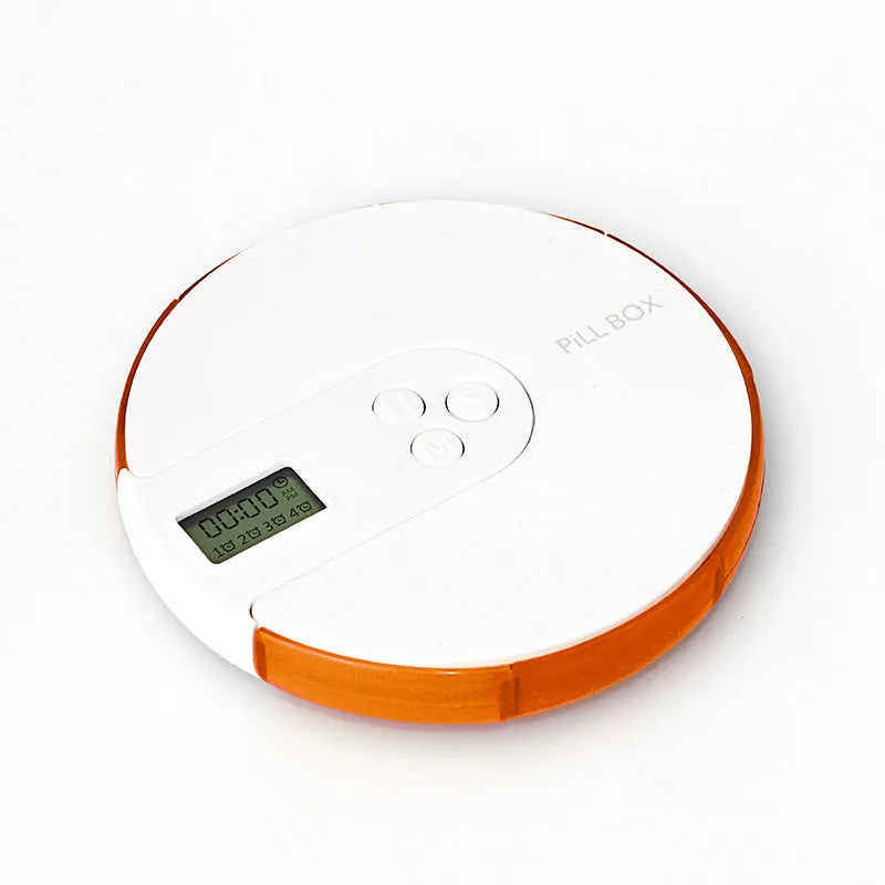 Blue seven-compartment electronic pill box with digital display and alarm clock, shown next to pills.