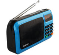 Golden Rolton W405 portable FM radio and MP3 speaker with LED display on a textured surface.