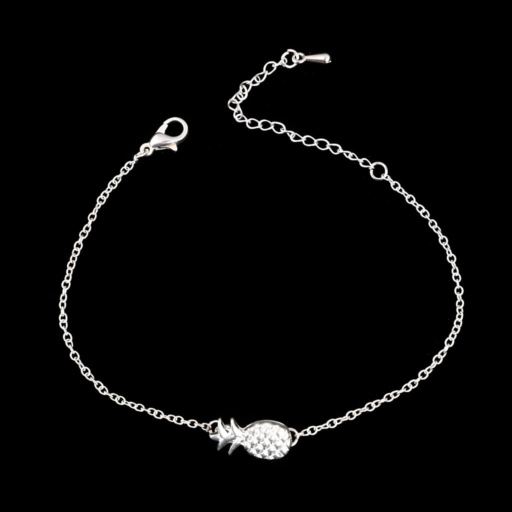 Gold tone alloy bracelet with a detailed pineapple charm on a simple bangle.