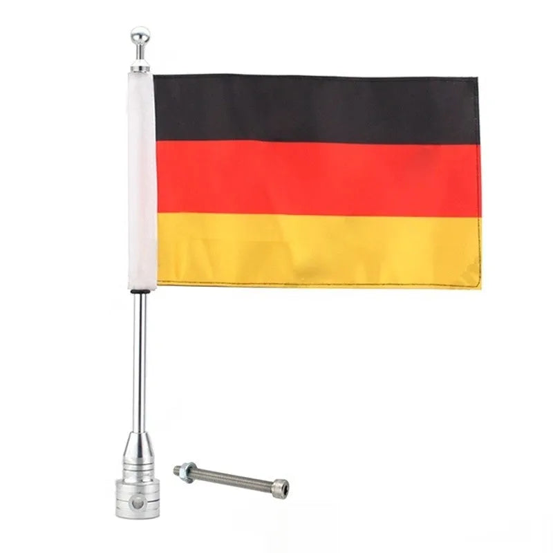 Silver electroplated tail box flagpole mounted on commercial vehicle parcel rack with German flag
