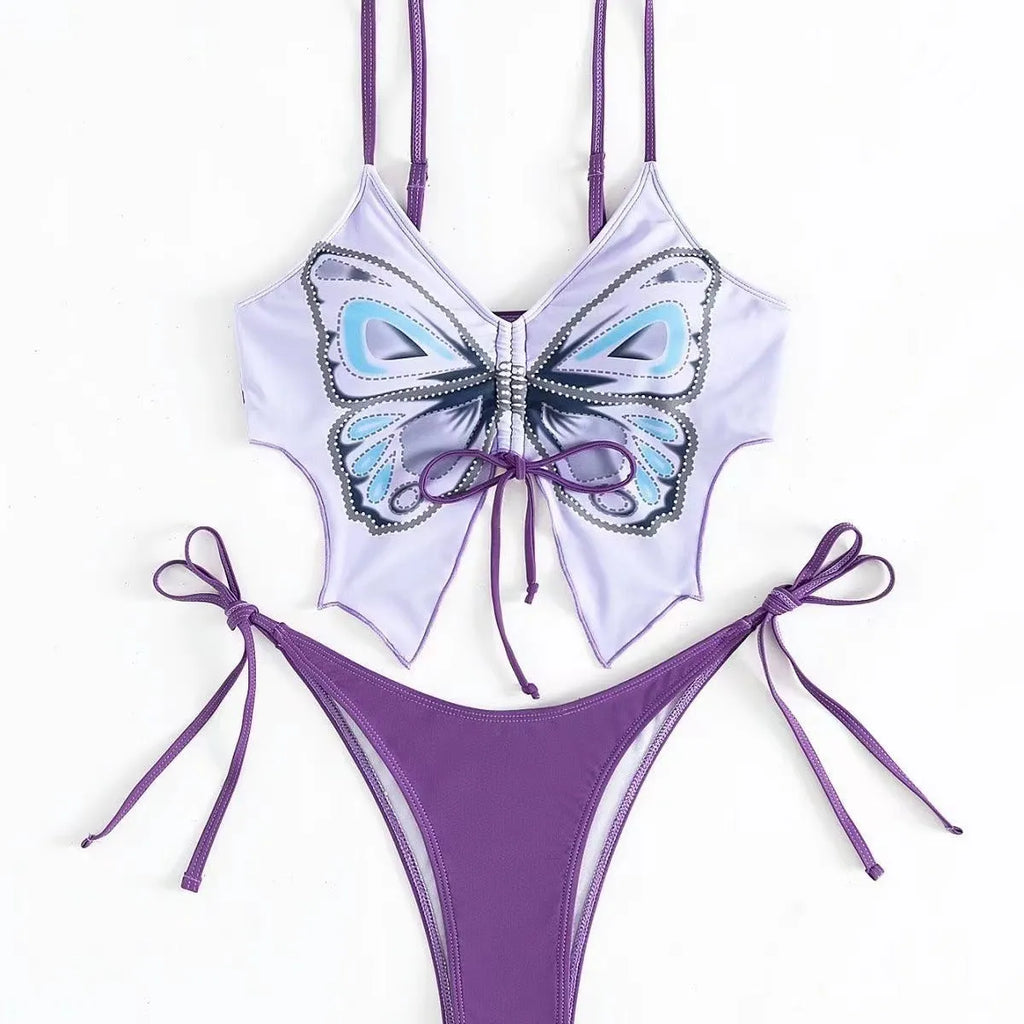 Women's purple bikini swimsuit with bow detail on top and split leg briefs.