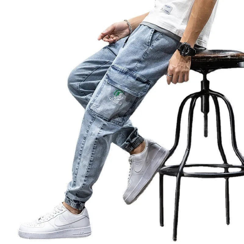 Man wearing loose fit blue cargo jeans with straight leg and cargo pockets