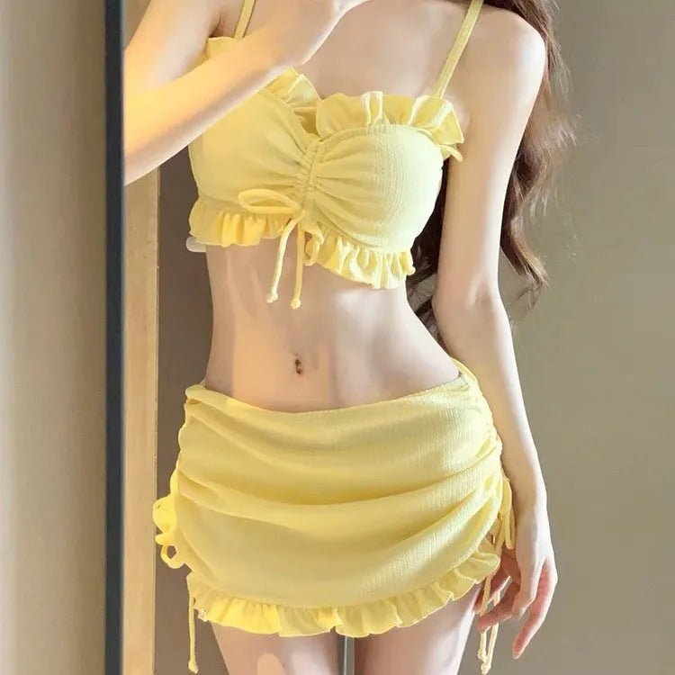 Women's solid colour milk silk bikini swimsuit top and pants set.