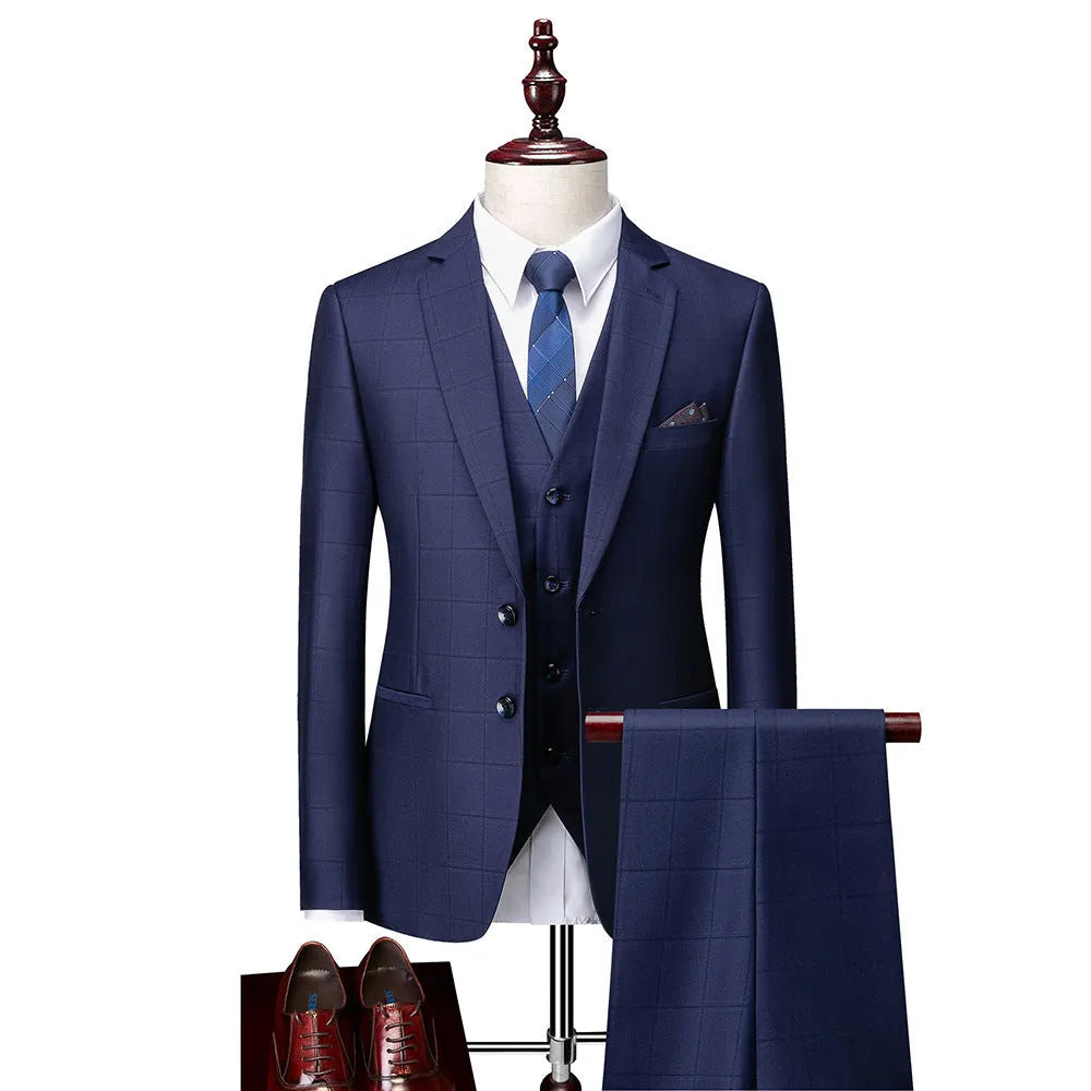 Men's navy blue plaid slim fit three-piece suit with jacket, vest, and trousers on a hanger.