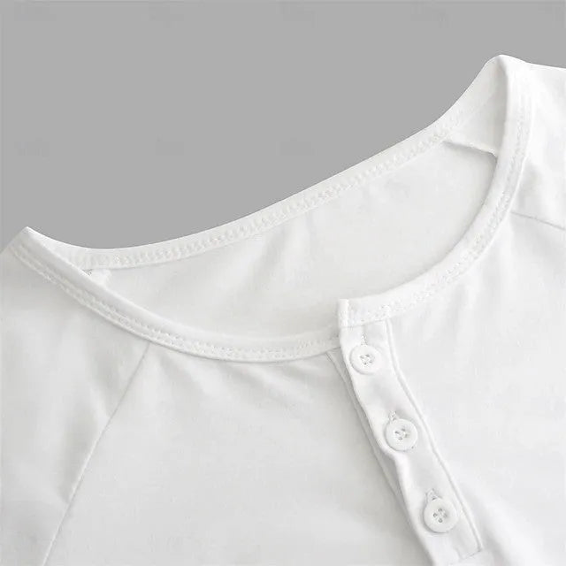 Men's white long-sleeved t-shirt with a Henry collar laying flat.