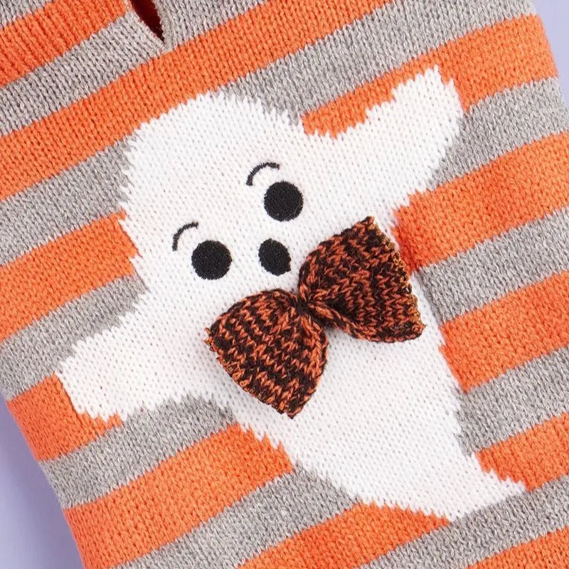 Orange Halloween knitted pet sweater with striped pattern and hooded design featuring fur ball decoration