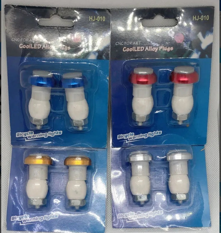 Aluminium alloy bicycle handlebar end lights in anodised colours with red LED illumination