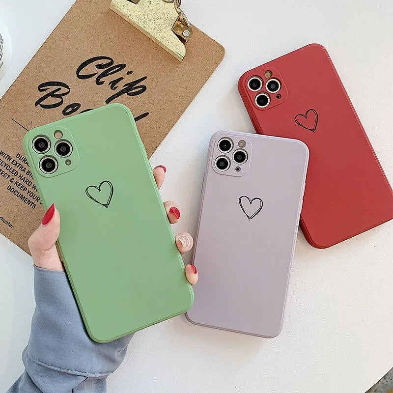 A solid colour silicone phone case for Apple iPhone on a table, showing its slim TPU back cover design.