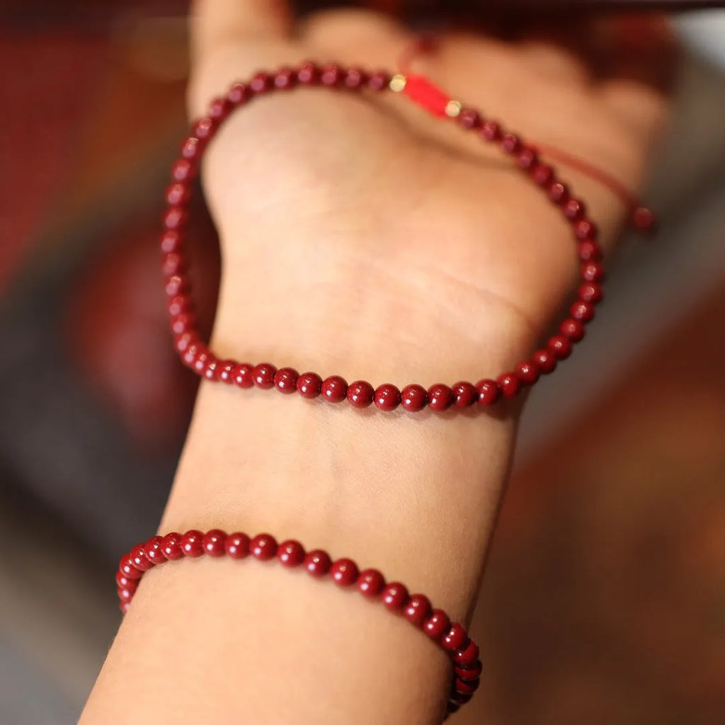 Women's handmade cinnabar bracelet with purple gold sand design and Chinese auspicious patterns.