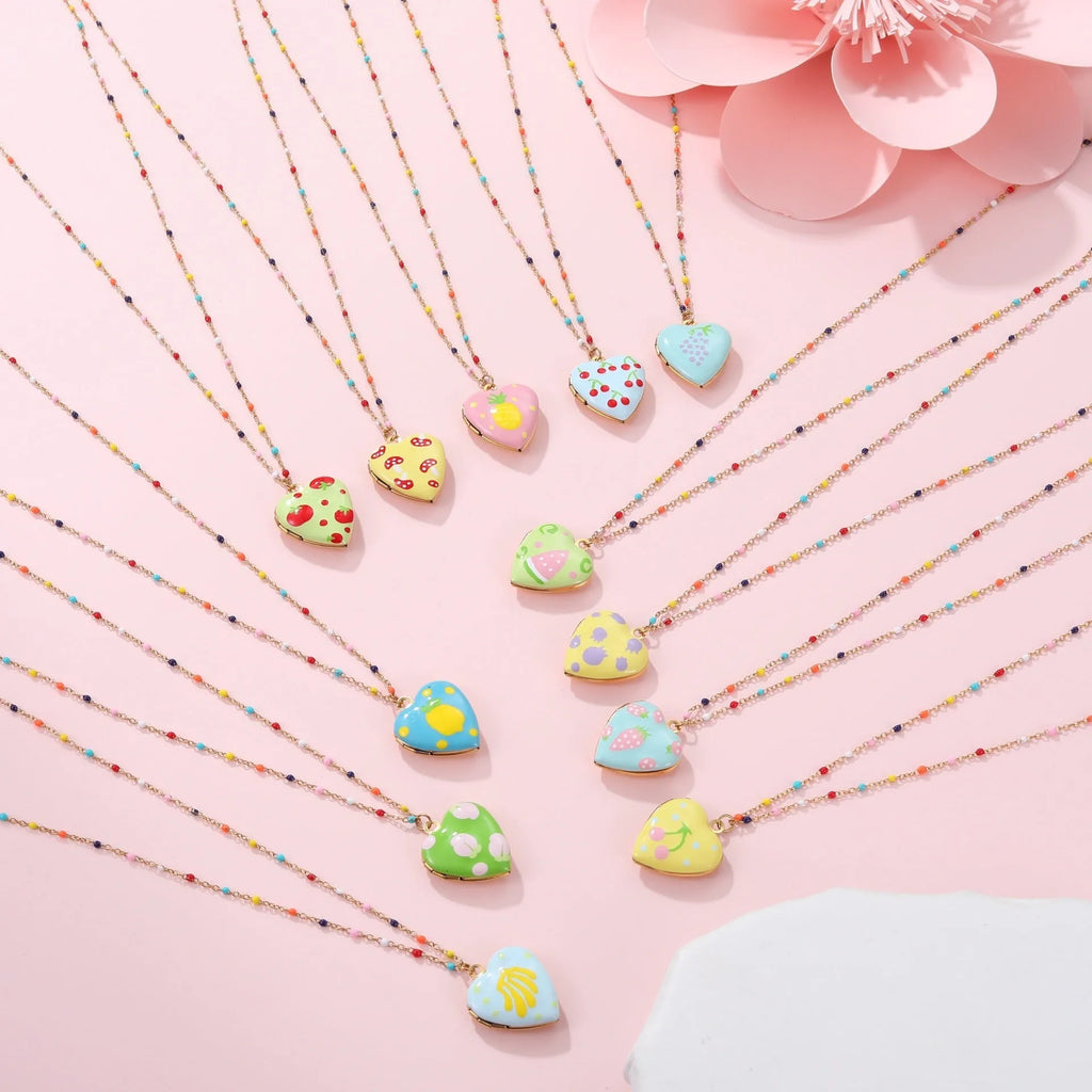 Gold-plated stainless steel necklace with a detailed strawberry-shaped pendant on a chain.