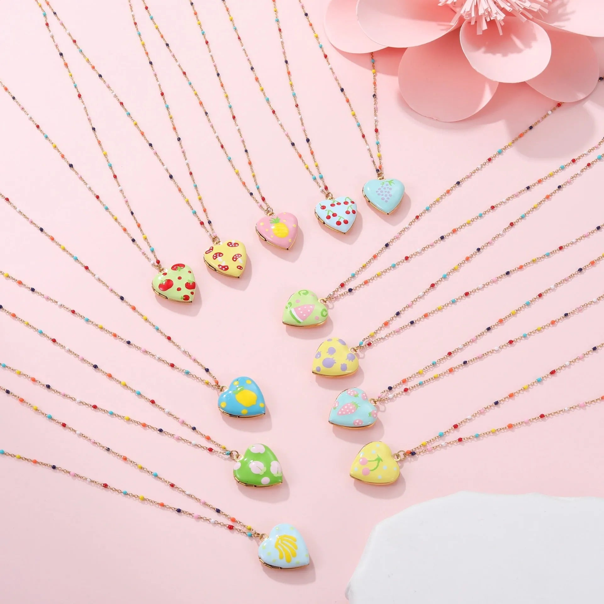 Gold-plated stainless steel necklace with a detailed strawberry-shaped pendant on a chain.