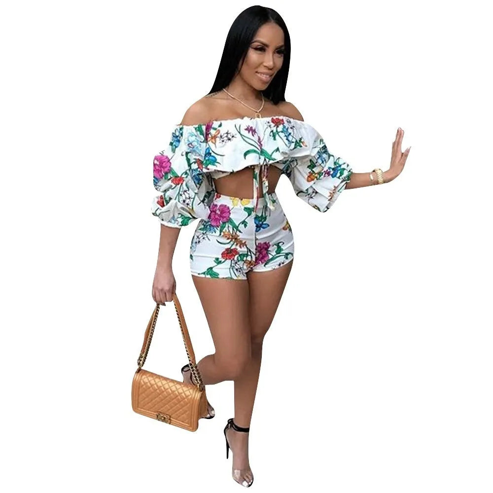 Women's multicolour digital print lounge set with puff-sleeved top and shorts.