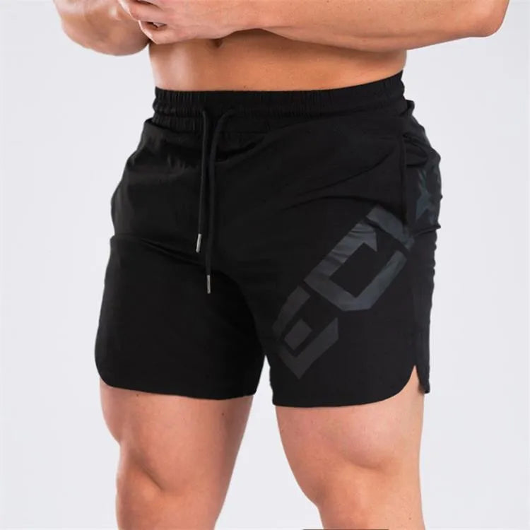 Men's elastic knee-length training shorts in quick-drying chemical blend fabric shown in black colour