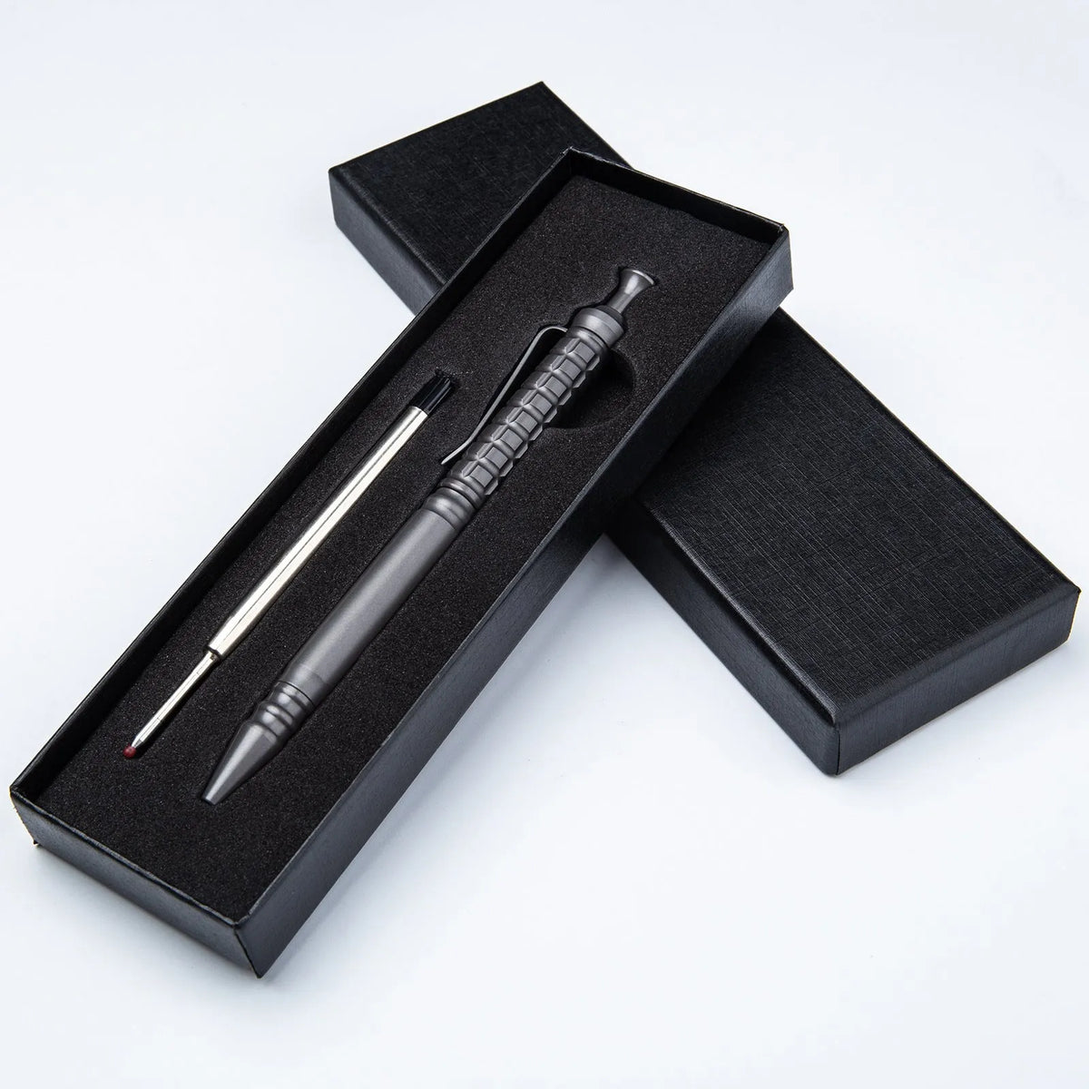 Gunmetal grey titanium alloy push-action pen with 0.5mm nib and gift box packaging