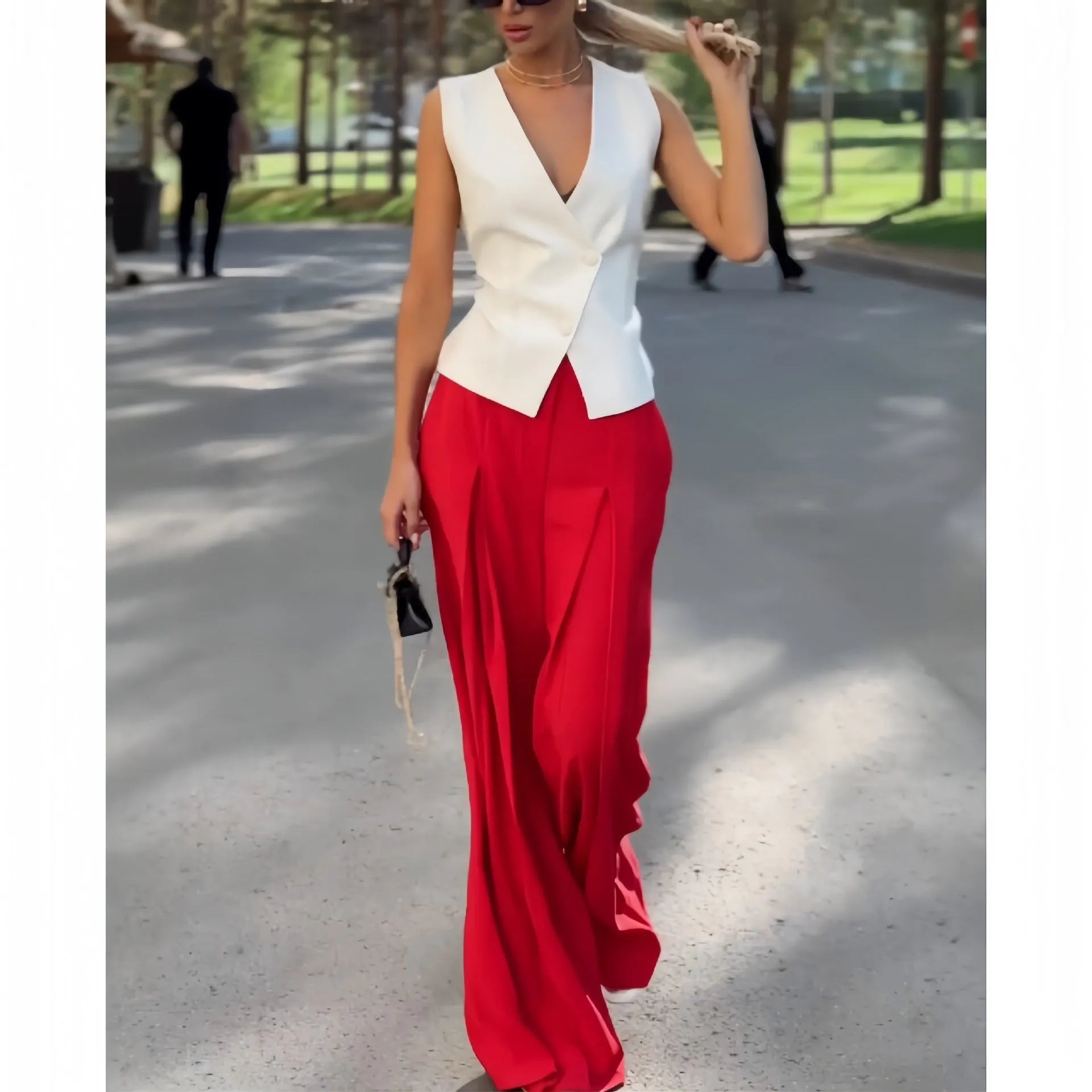 Women's beige polyester two-piece set with sleeveless deep V-neck top and high-waist wide-leg trousers.